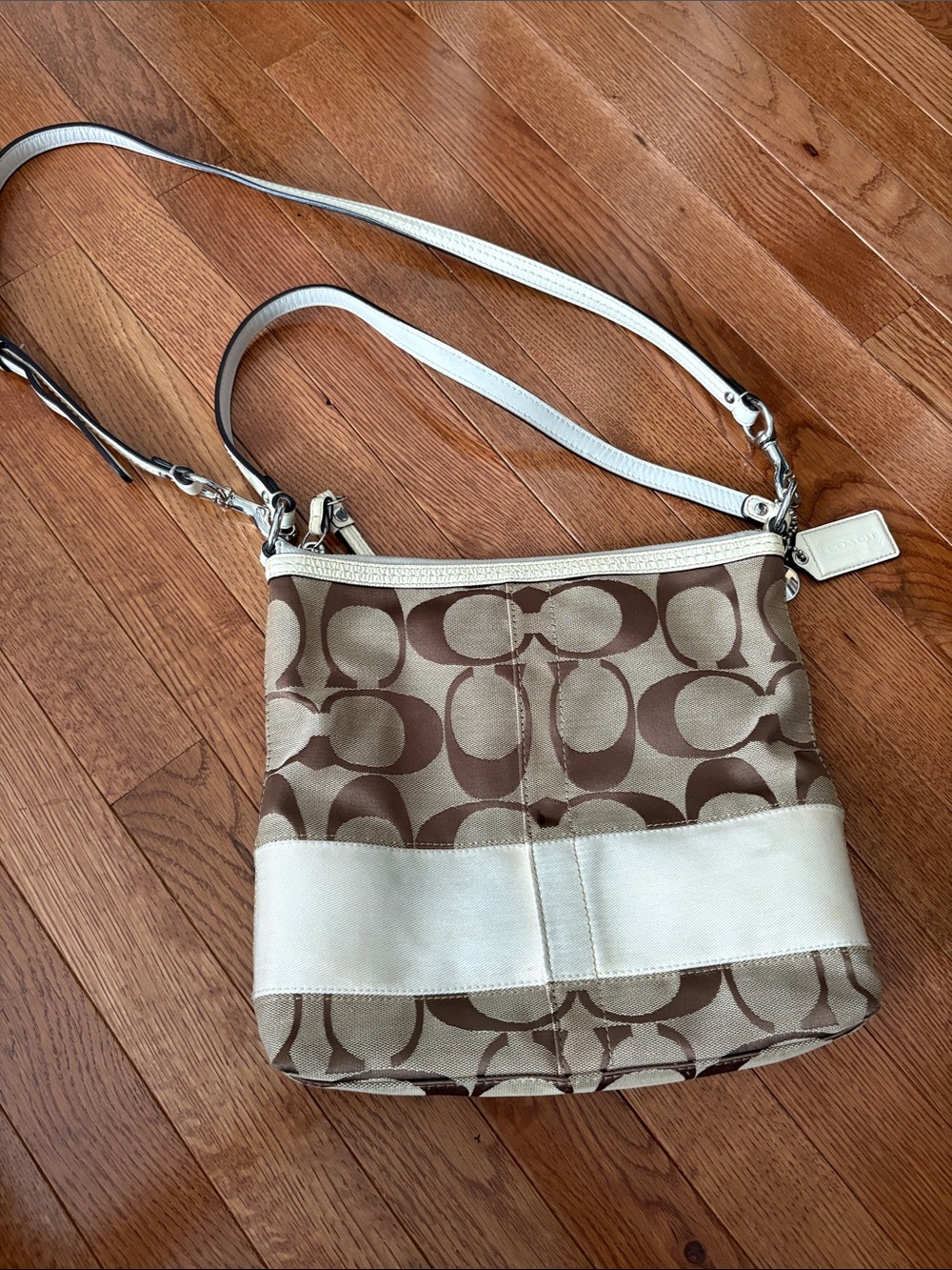 Coach tan and brown Signature Stripe Bag (F13674) features a classic